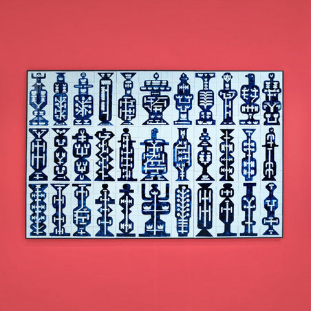 Royal Delft hand-painted ceramic tile tableau featuring 345 unique blue totem patterns on a vibrant red wall.