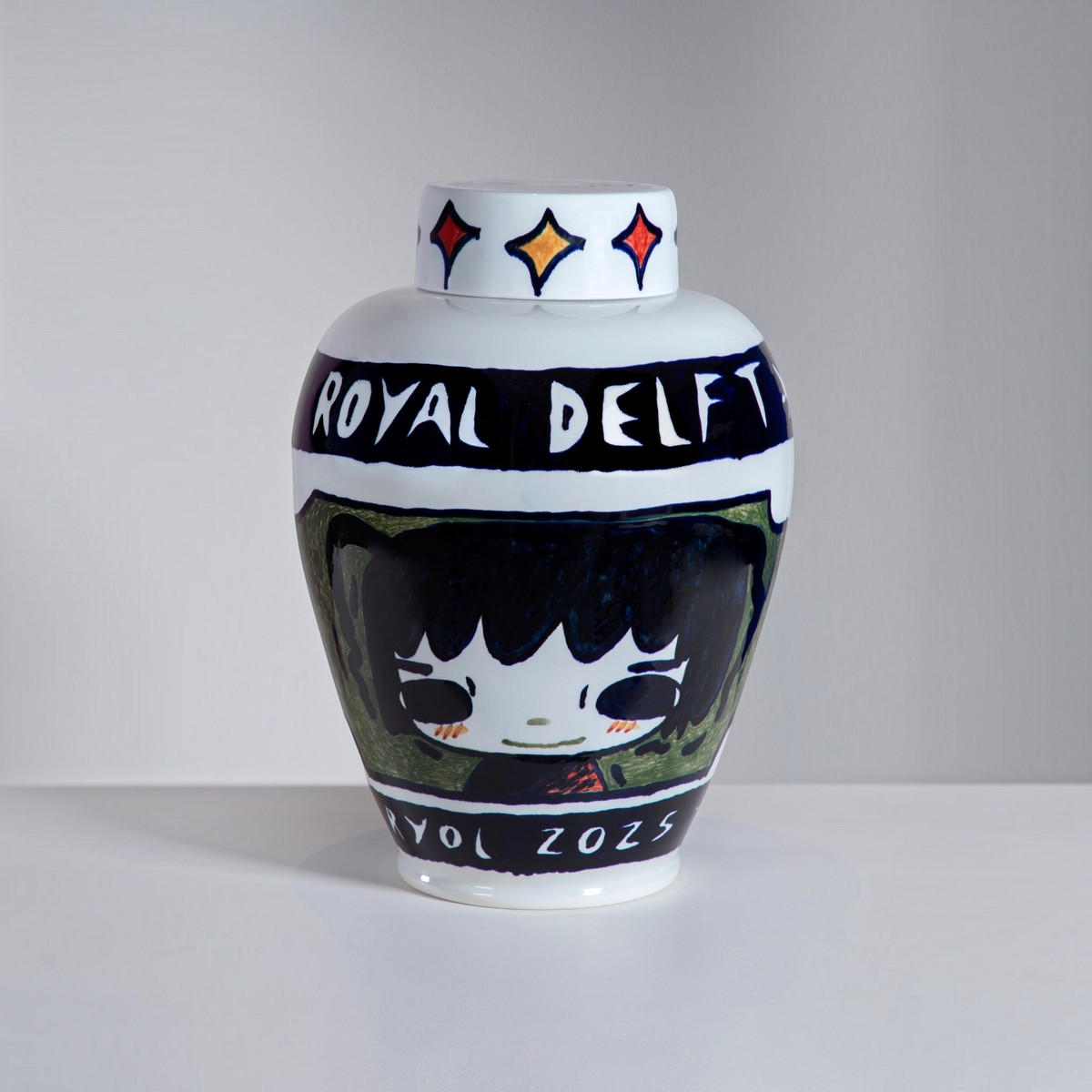 Royal Delft ceramic vase with removable lid, featuring hand-painted anime-style character and Royal Delft banner.