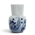 Royal Delft Giulia vase featuring blue and white floral patterns with bees on a ribbed porcelain body