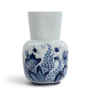 Royal Delft Giulia vase featuring blue and white floral patterns with bees on a ribbed porcelain body